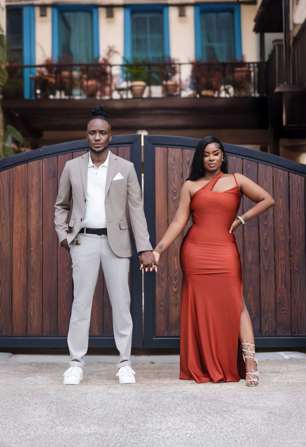 Couple in a cream suit and red gown