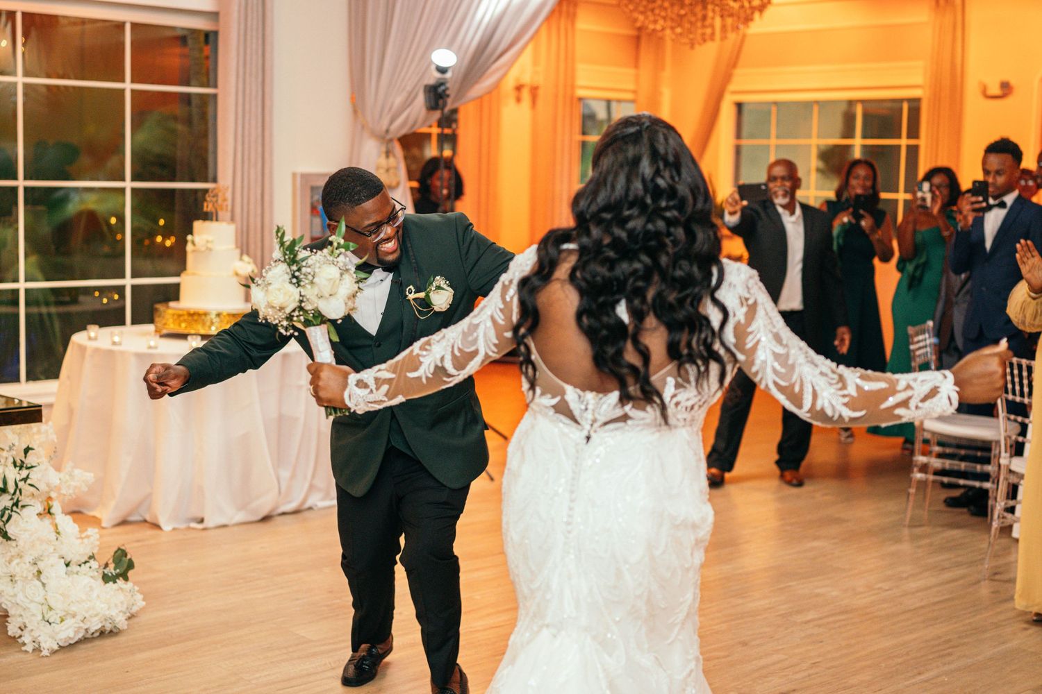 Couple celebrating with guests at their wedding reception