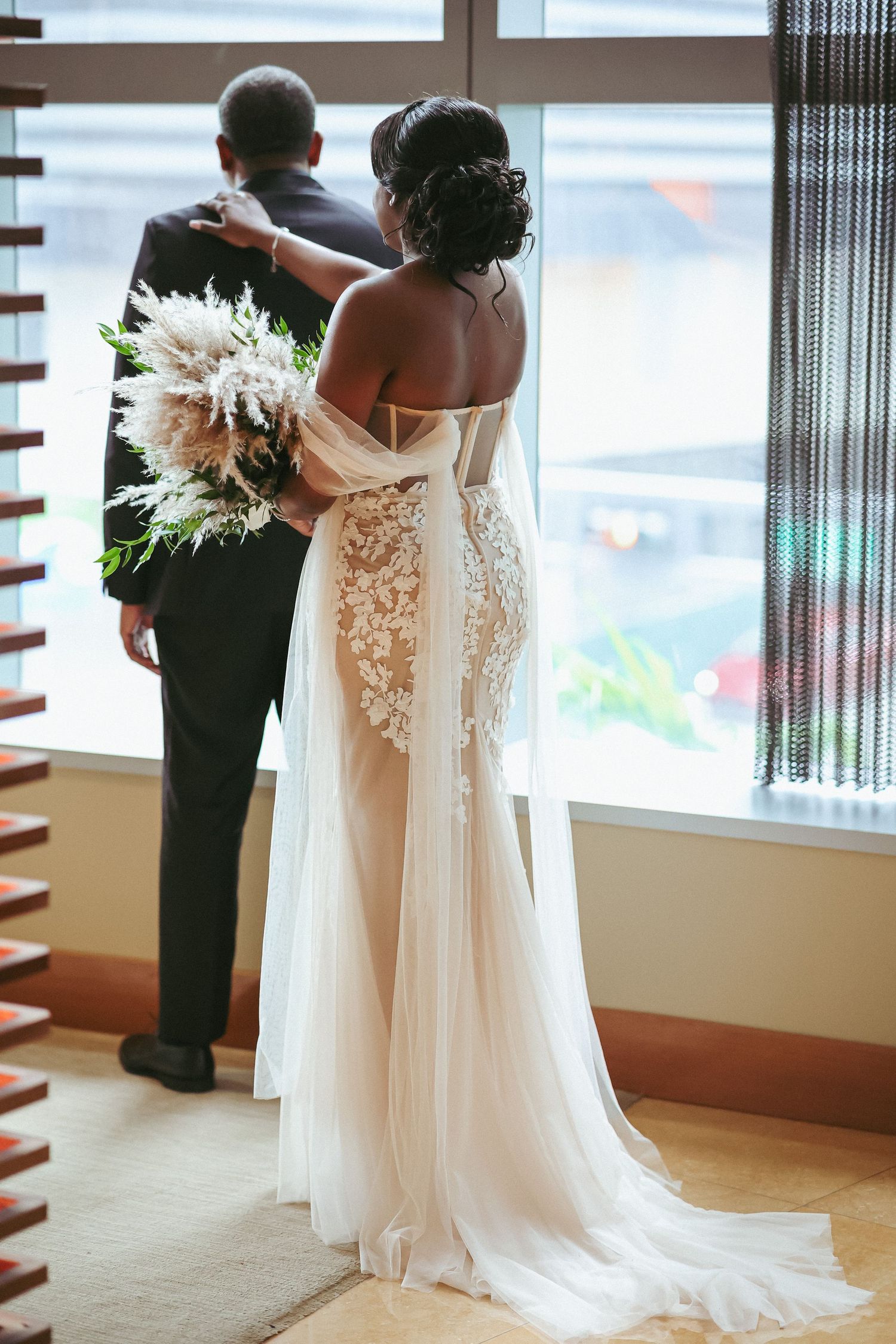 Wedding gown and veil in window light