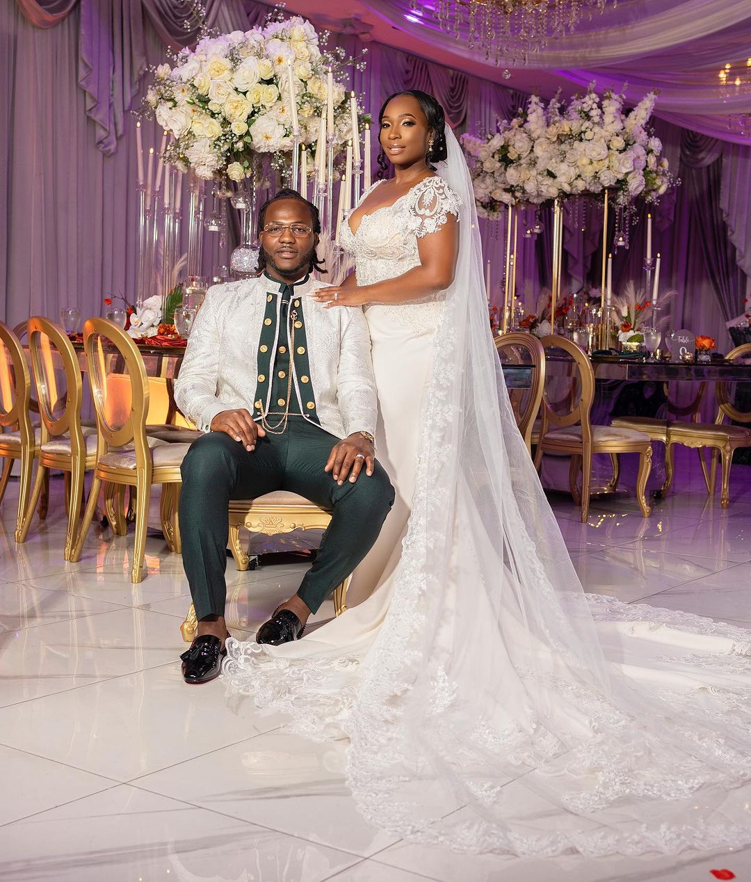 Couple together at their sweetheart table during the reception