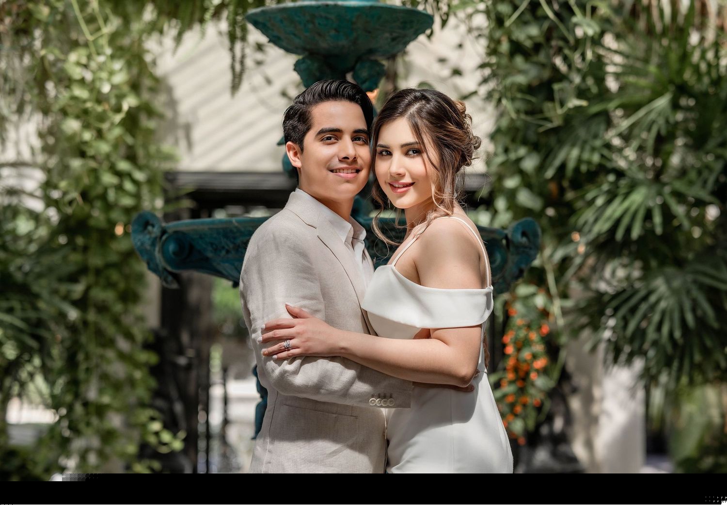 Couple smiling together in a garden