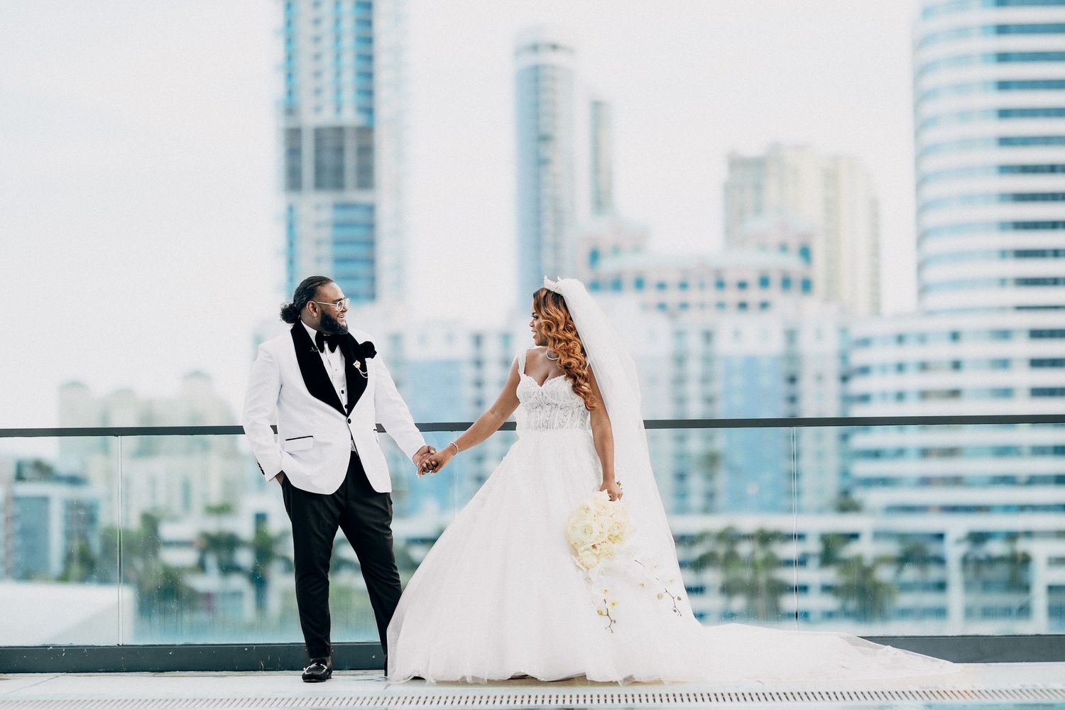 Couple photographed against a city skyline