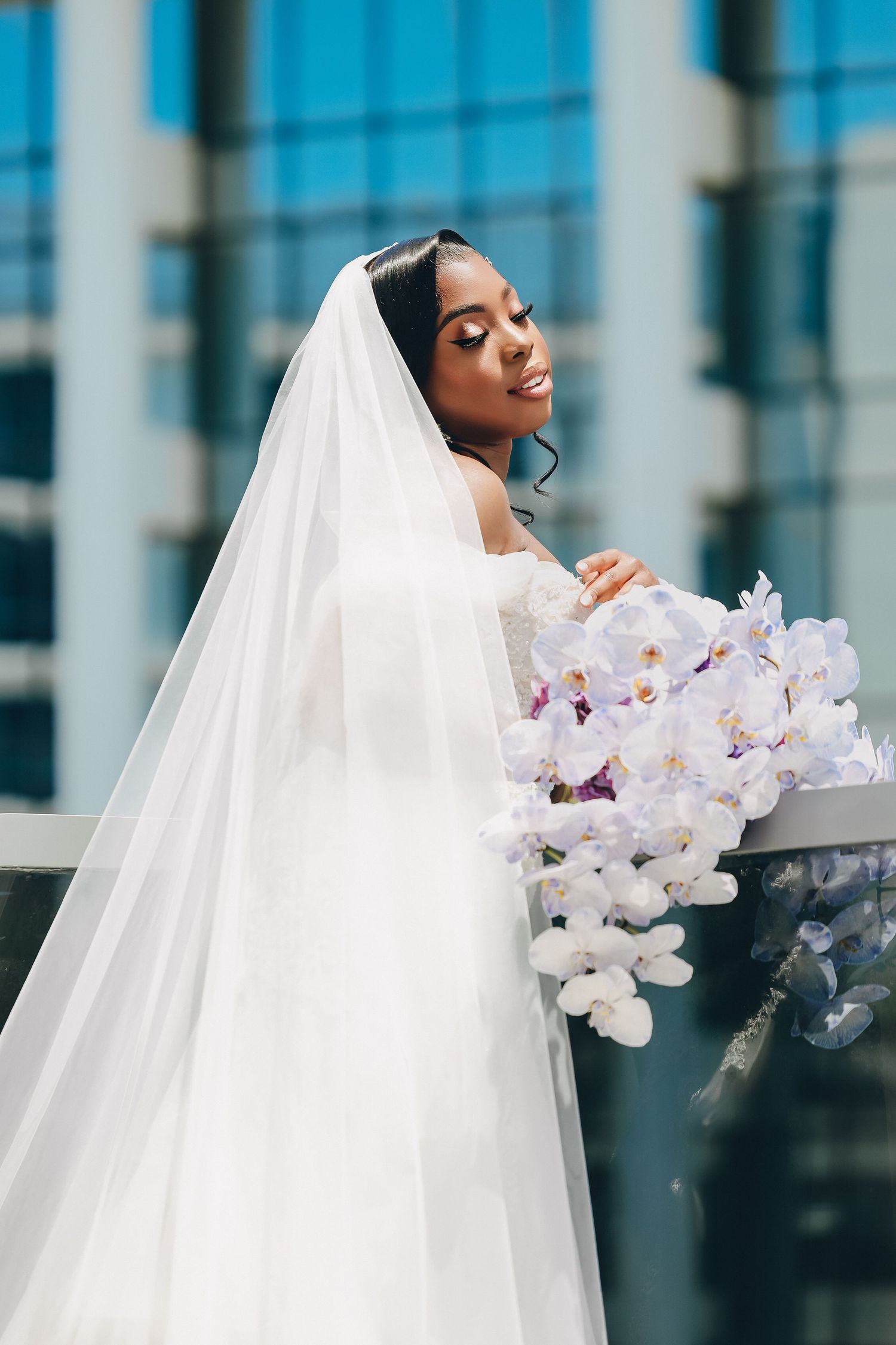 Bride in her veil among white florals